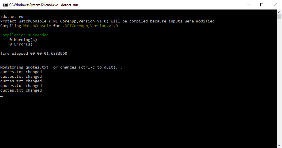Command window after executing dotnet run shows the application monitoring the quotes.txt file for changes and that the file has changed five times.